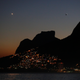 The lights of Vidigal favela are seen with the Dois Irmaos (Two brothers) peaks in Rio de Janeiro, Brazil July 4, 2016. REUTERS/Pawel Kopczynski - RTX2JPHS